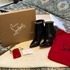 Christian Louboutin black leather stud booties.